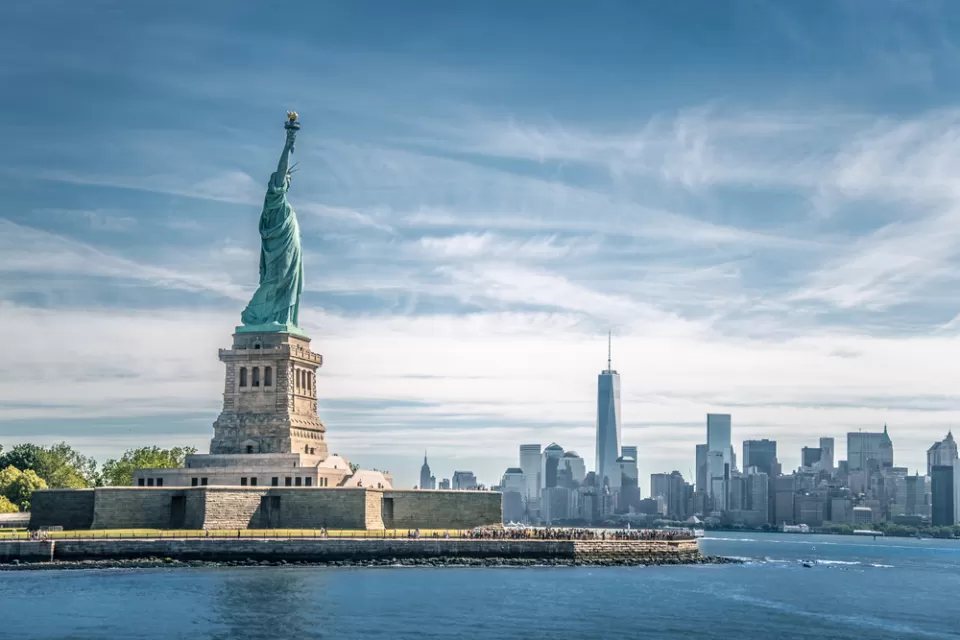 View of Statue of Liberty with New York City skyline in background